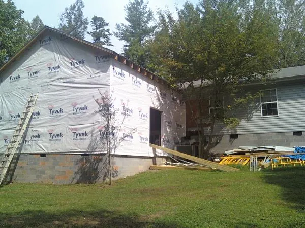 Tyvek wrapped gable on a new room addition beside an existing home in Harpers Ferry